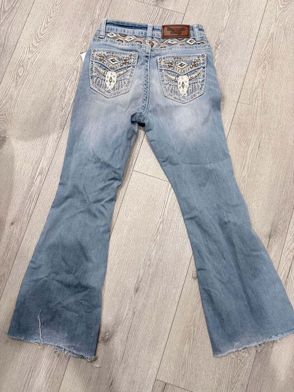 Wasteland Embellished Bull Skull Distressed Flare Jeans with Raw Hem